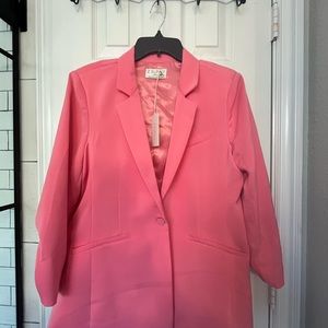 Women’s suit jacket, loose fitting, cute with jeans or work attire. Never worn